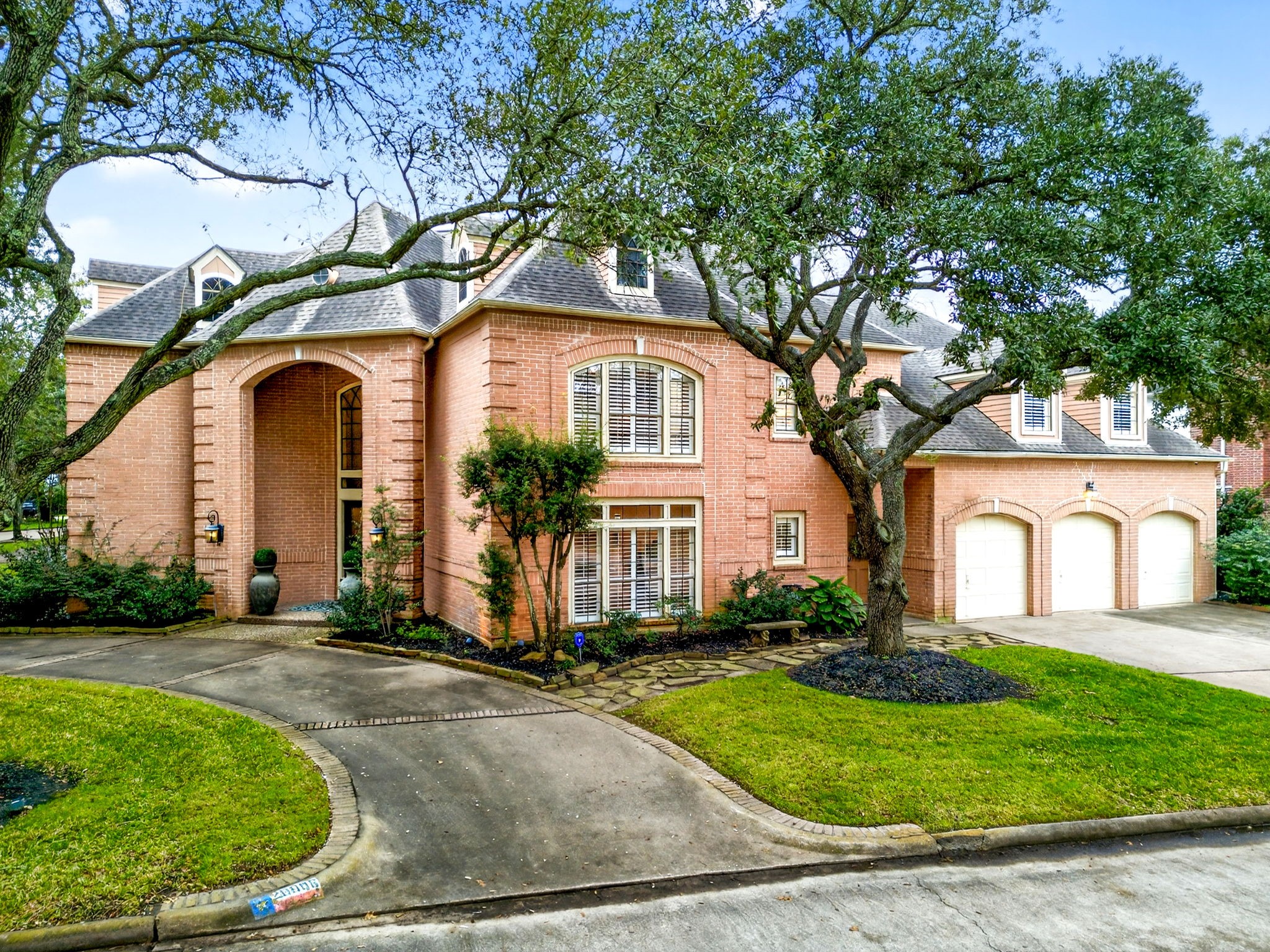 20006 Gable Point Drive Katy, TX 77450 - Photo 3 of 44 a front view of a house with garden