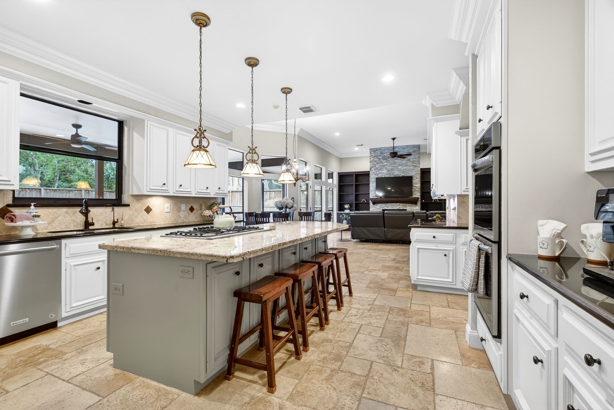 20006 Gable Point Drive Katy, TX 77450 - Photo 8 of 44 a kitchen with stainless steel appliances kitchen island granite countertop a sink and cabinets