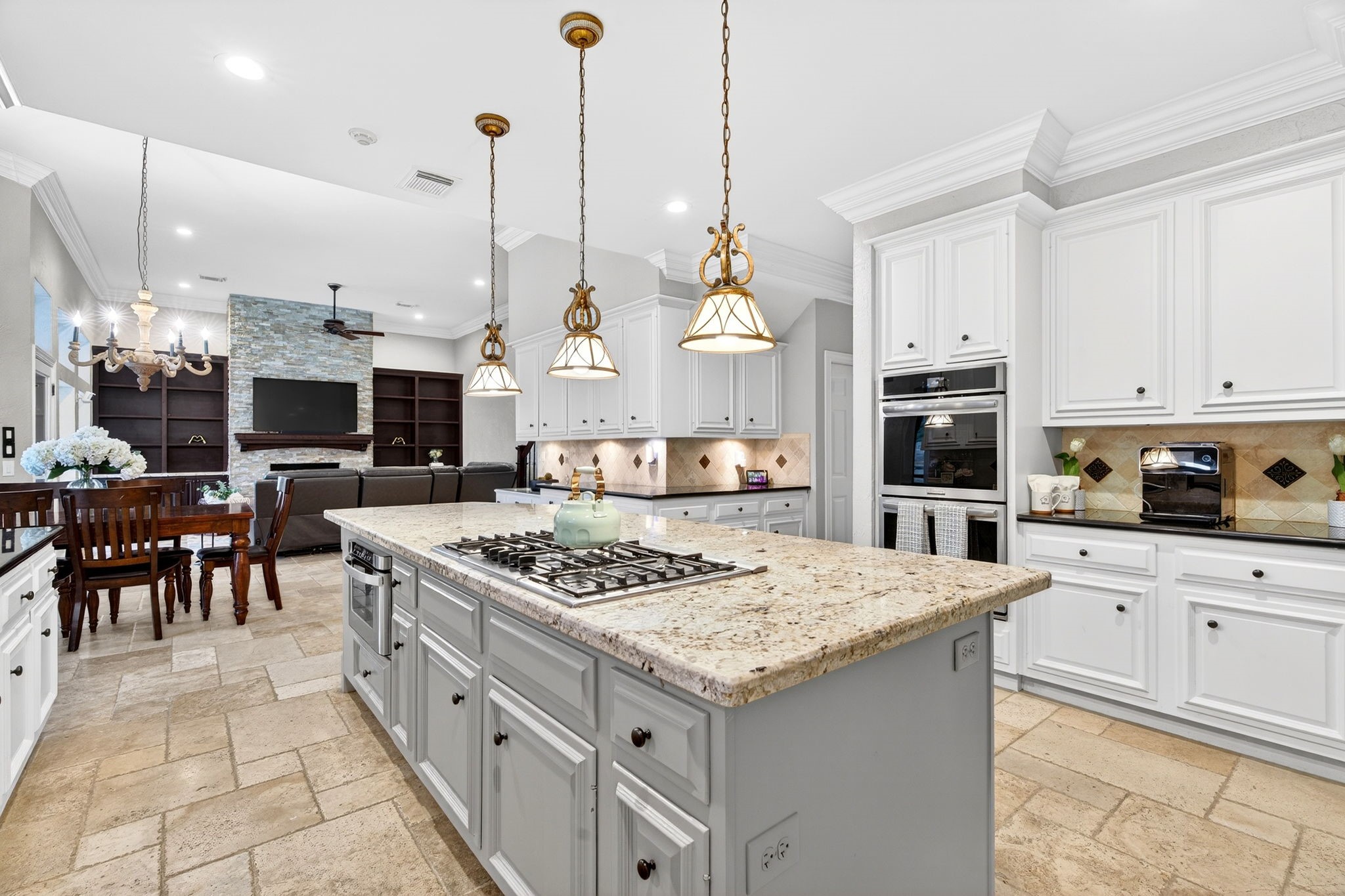 20006 Gable Point Drive Katy, TX 77450 - Photo 9 of 44 a kitchen with stainless steel appliances kitchen island granite countertop a stove a sink and a refrigerator