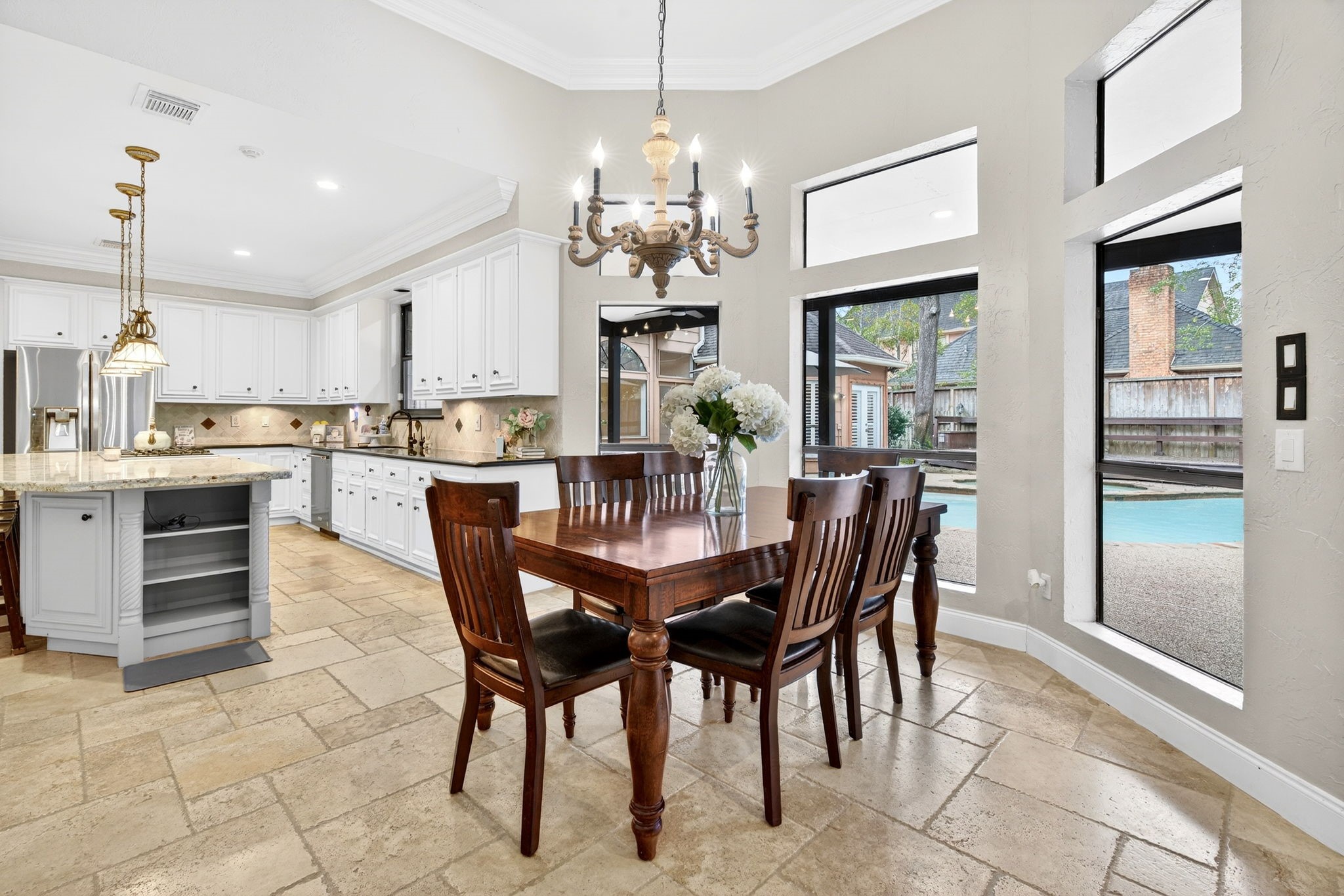 20006 Gable Point Drive Katy, TX 77450 - Photo 10 of 44 a dining room filled chandelier and kitchen view