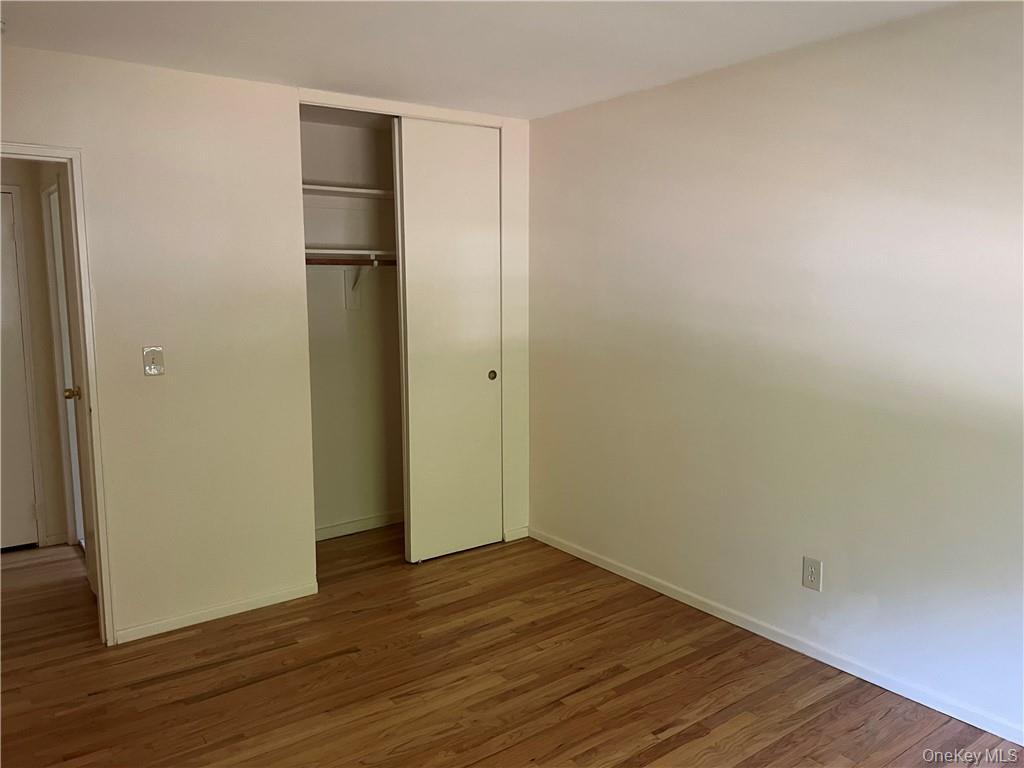 65 Curie Road, Unit G7 Cornwall-on-Hudson, NY 12520 - Photo 11 of 12 a view of empty room with wooden floor