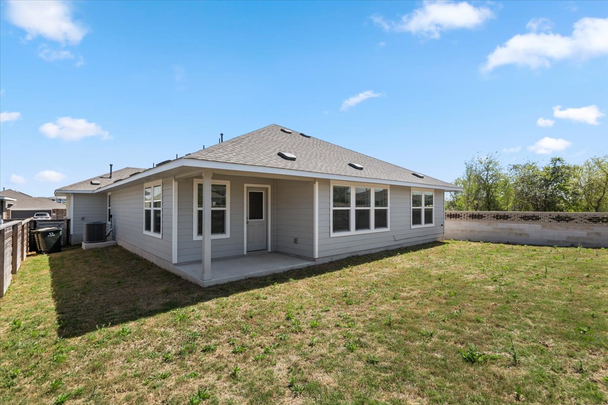 167 Jeffers Kyle, TX 78640 - Photo 36 of 40 Back of property with a patio area, a fenced backyard, and a shingled roof