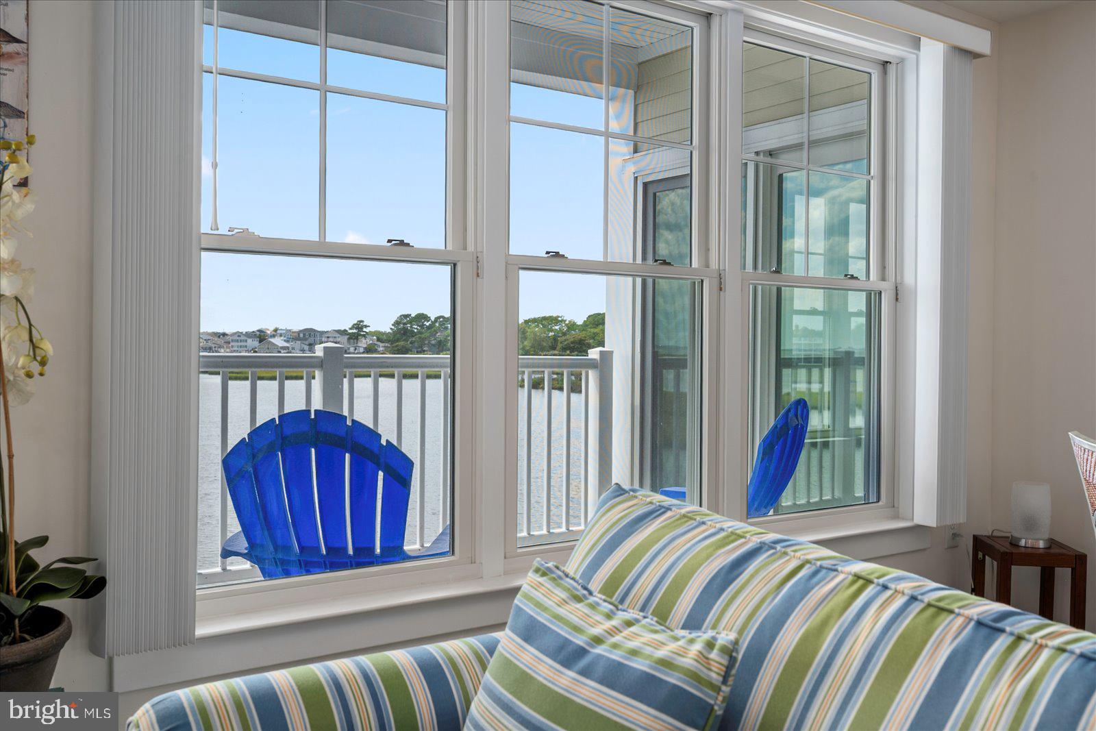 37292 Lighthouse Road, Unit 202 Selbyville, DE 19975 - Photo 13 of 78 a view of a bedroom with furniture and balcony