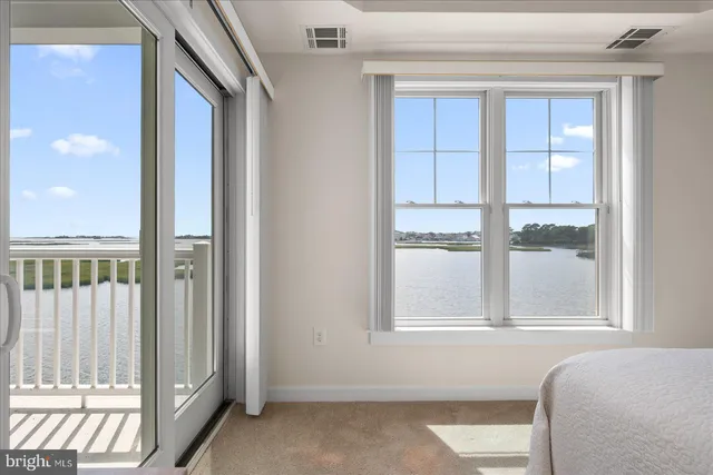 a living room with furniture and a lamp