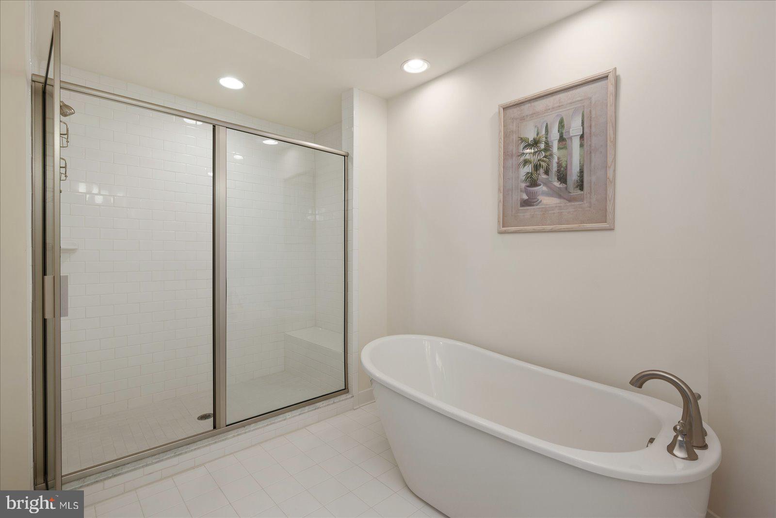 37292 Lighthouse Road, Unit 202 Selbyville, DE 19975 - Photo 36 of 78 a white bath tub sitting next to a shower