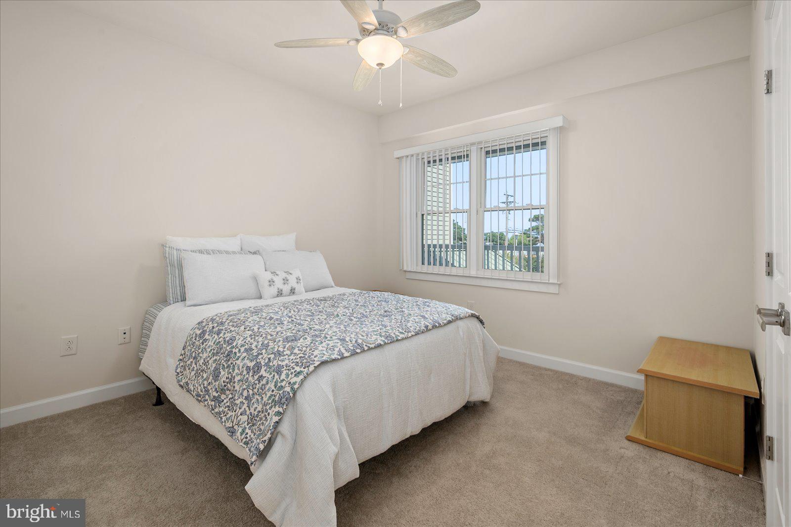 37292 Lighthouse Road, Unit 202 Selbyville, DE 19975 - Photo 38 of 78 a bedroom with a bed and a window