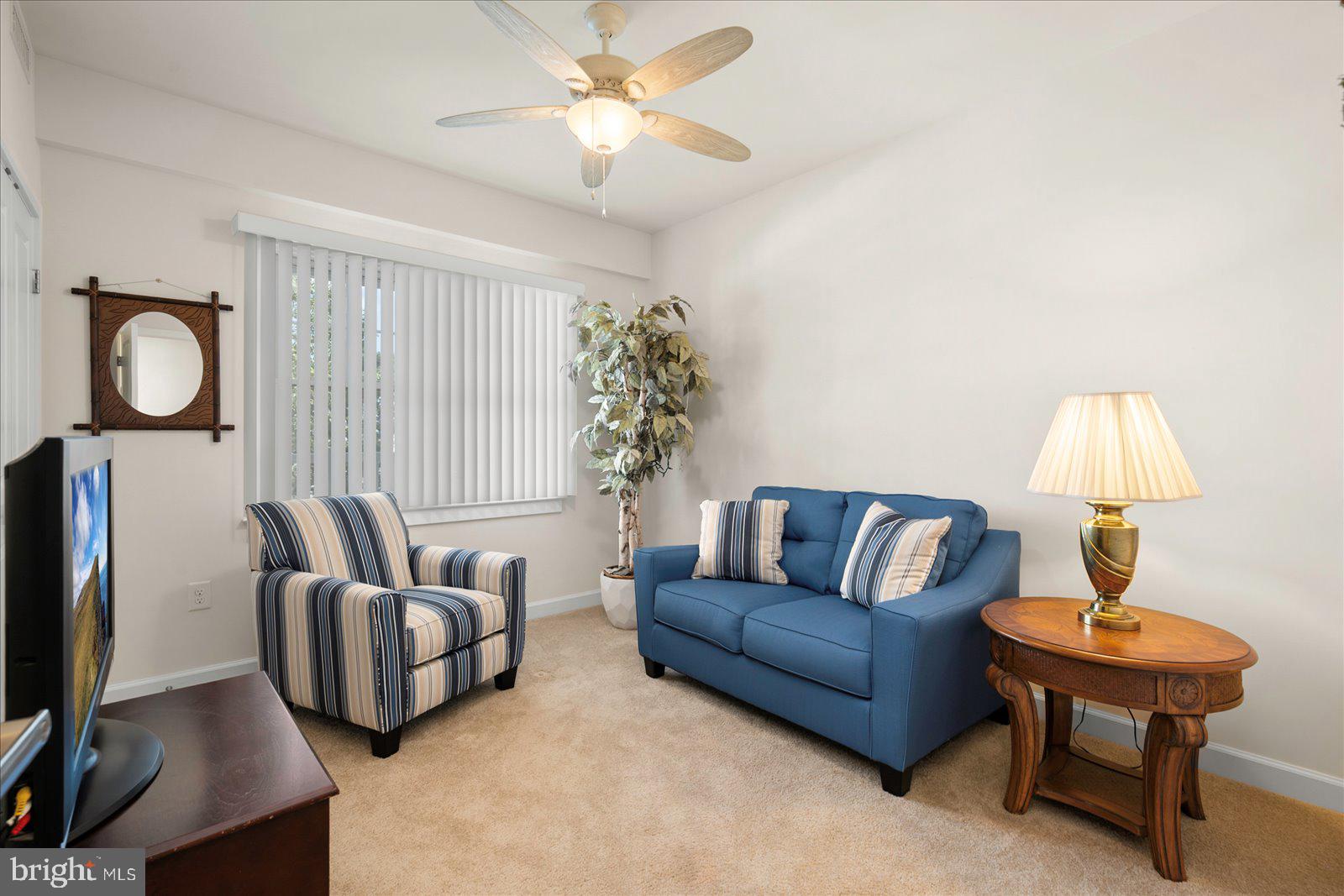 37292 Lighthouse Road, Unit 202 Selbyville, DE 19975 - Photo 42 of 78 a living room with furniture and a lamp