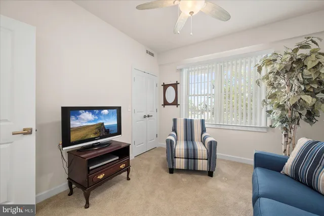 a view of a swimming pool and an outdoor seating