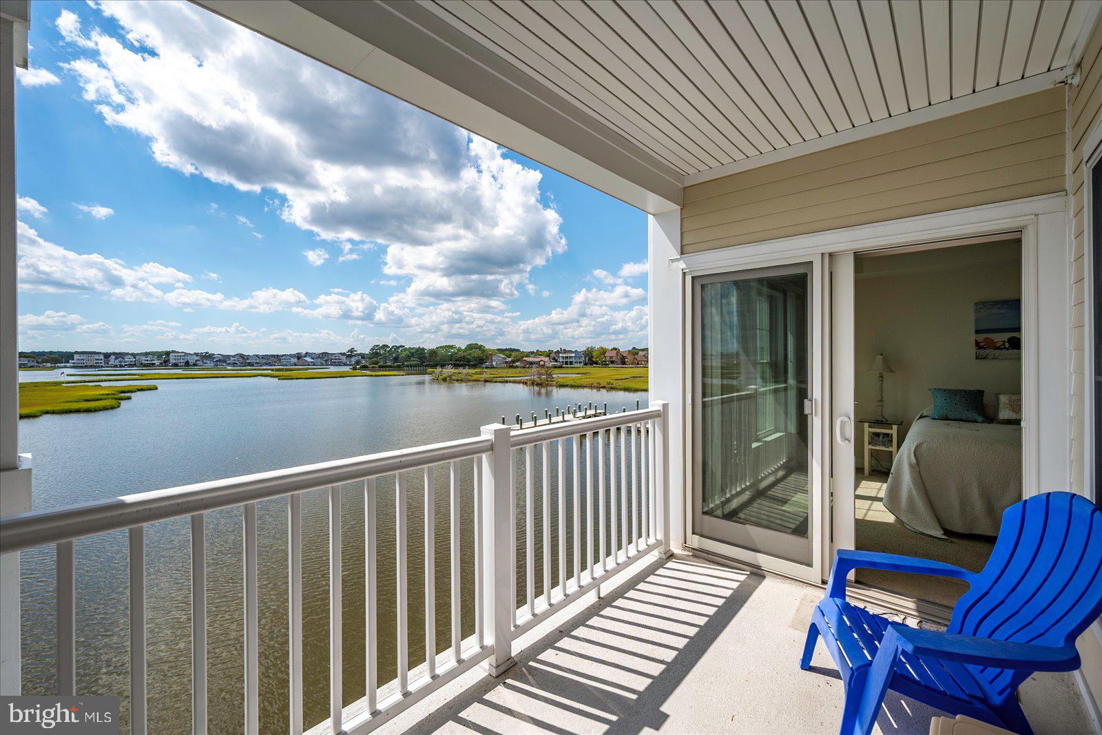 37292 Lighthouse Road, Unit 202 Selbyville, DE 19975 - Photo 47 of 78 a view of a balcony with chair and wooden floor