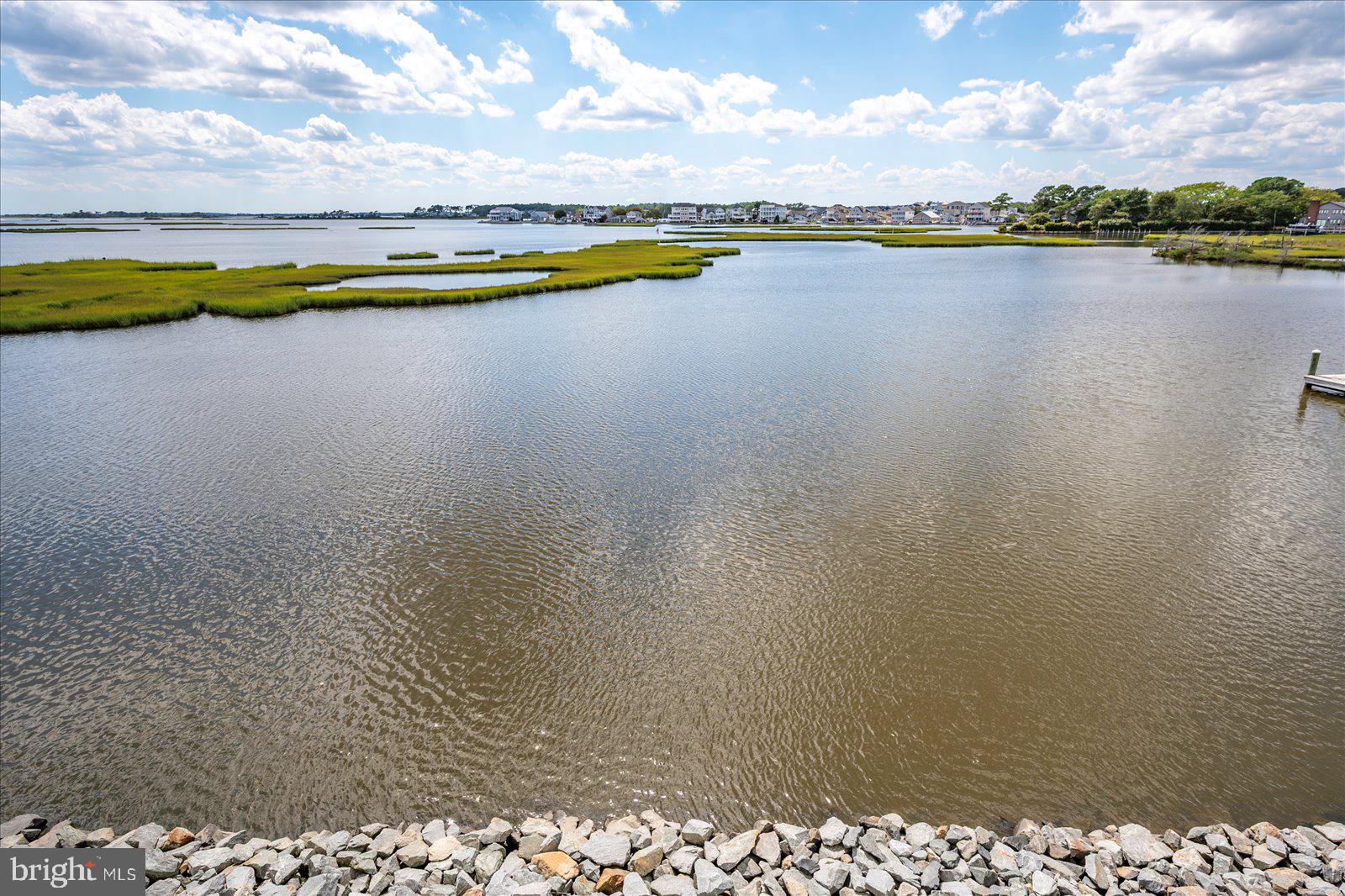 37292 Lighthouse Road, Unit 202 Selbyville, DE 19975 - Photo 50 of 78 a view of a lake with a city view