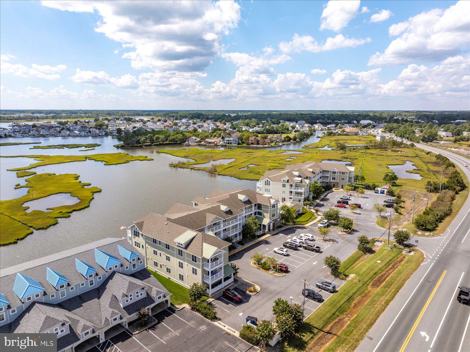 37292 Lighthouse Road, Unit 202 Selbyville, DE 19975 - Photo 61 of 78 a view of a swimming pool and an outdoor seating
