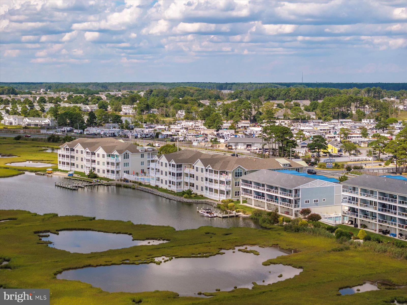 37292 Lighthouse Road, Unit 202 Selbyville, DE 19975 - Photo 64 of 78 an aerial view of residential houses with lake view