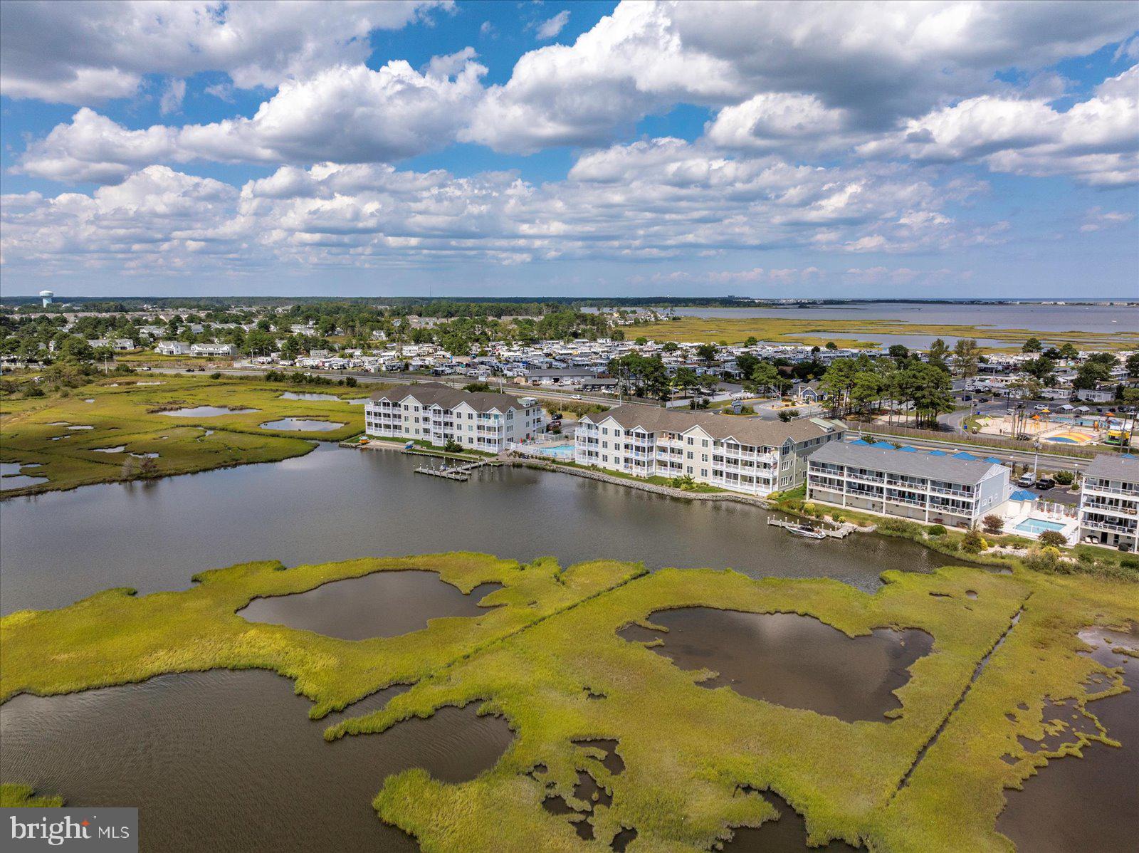 37292 Lighthouse Road, Unit 202 Selbyville, DE 19975 - Photo 65 of 78 a view of a city with an ocean beach