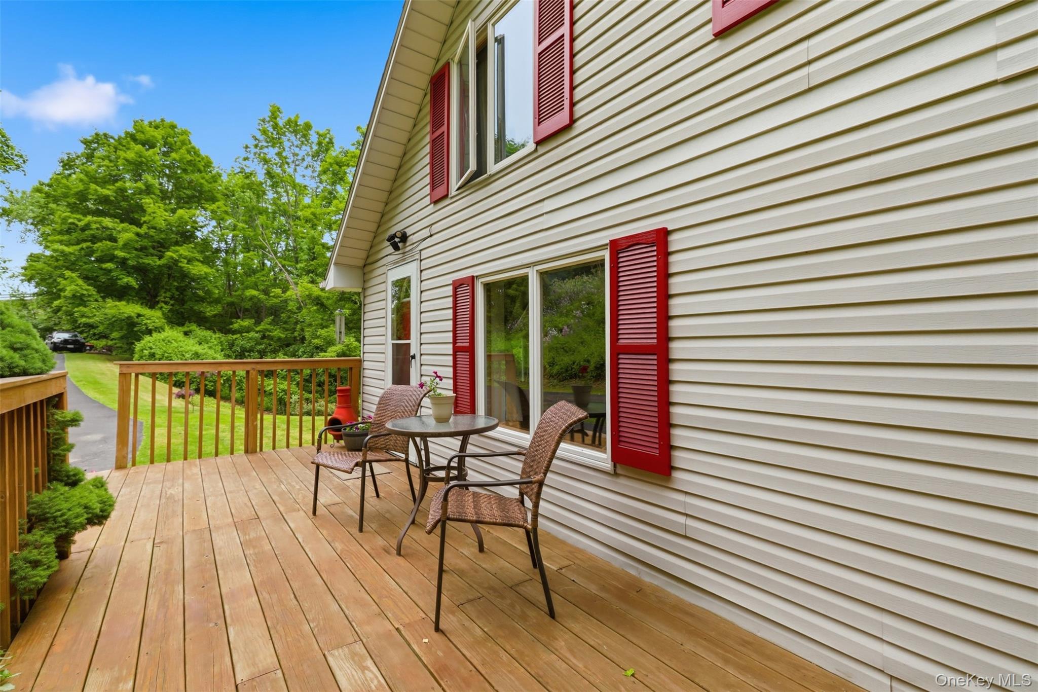 236 Hosner Mountain Road Hopewell Junction, NY 12533 - Photo 6 of 46 Double-sided wood-finish deck with a wood railing system, offering outdoor living space
