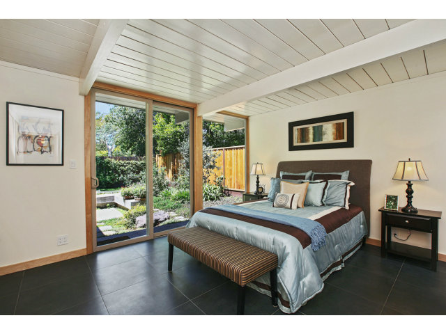 3390 Greer Road Palo Alto, CA 94303 - Photo 12 of 25 a bedroom with a bed and a large window