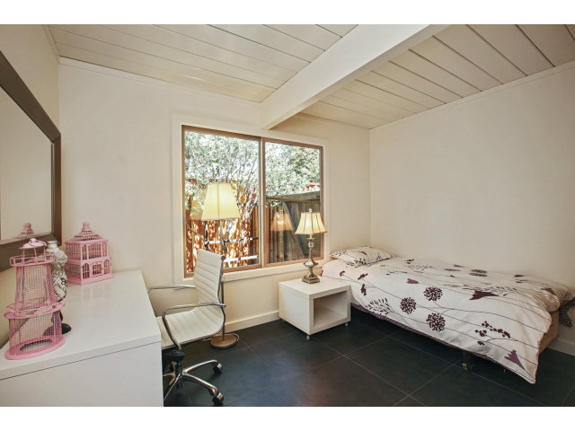 3390 Greer Road Palo Alto, CA 94303 - Photo 17 of 25 a bedroom with a bed and a table