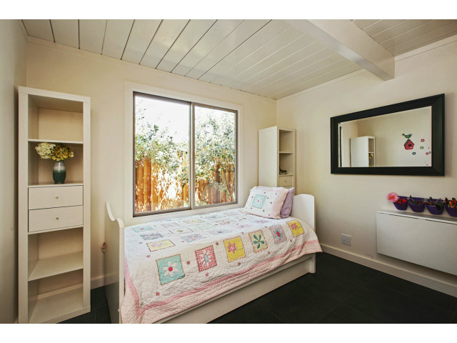3390 Greer Road Palo Alto, CA 94303 - Photo 18 of 25 a bedroom with a bed a large window with outer view