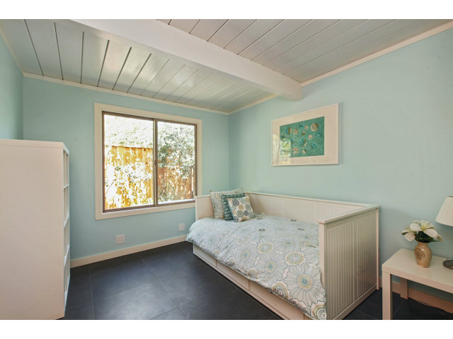 3390 Greer Road Palo Alto, CA 94303 - Photo 19 of 25 a bedroom with a bed and a window