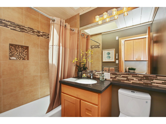3390 Greer Road Palo Alto, CA 94303 - Photo 22 of 25 a bathroom with a sink a mirror and a shower