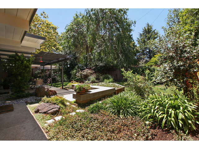 3390 Greer Road Palo Alto, CA 94303 - Photo 23 of 25 a view of a backyard with sitting area