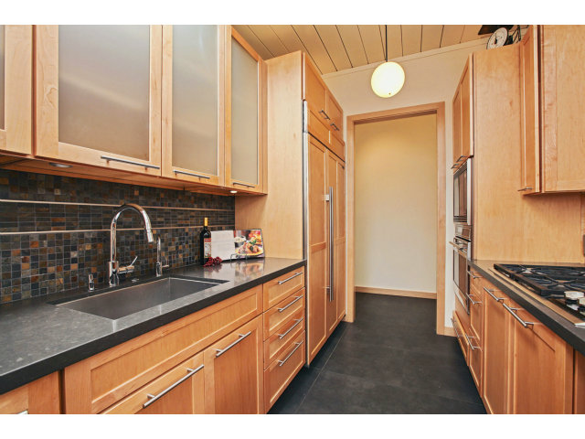 3390 Greer Road Palo Alto, CA 94303 - Photo 6 of 25 a kitchen with granite countertop a sink a stove and cabinets