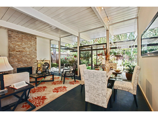 3390 Greer Road Palo Alto, CA 94303 - Photo 7 of 25 a living room filled with furniture and floor to ceiling windows