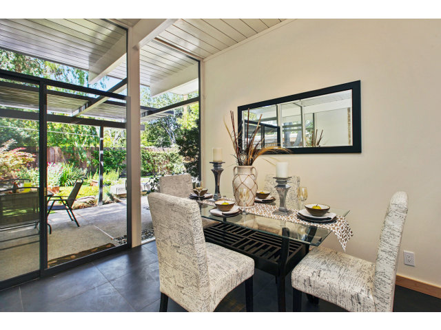 3390 Greer Road Palo Alto, CA 94303 - Photo 10 of 25 a living room with furniture and a floor to ceiling window