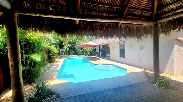 a view of a backyard of the house