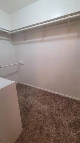 a view of a utility room with white wall