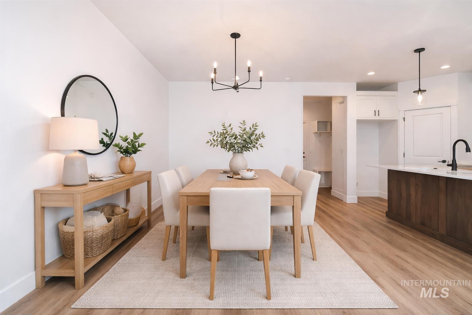 752 South Calhoun Place Star, ID 83669 - Photo 10 of 40 Dining area featuring suspended lighting and light wood-type flooring