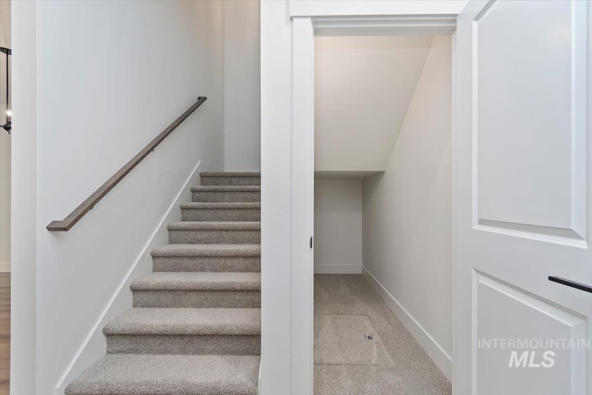 752 South Calhoun Place Star, ID 83669 - Photo 13 of 40 Stairway featuring baseboards and carpet floors