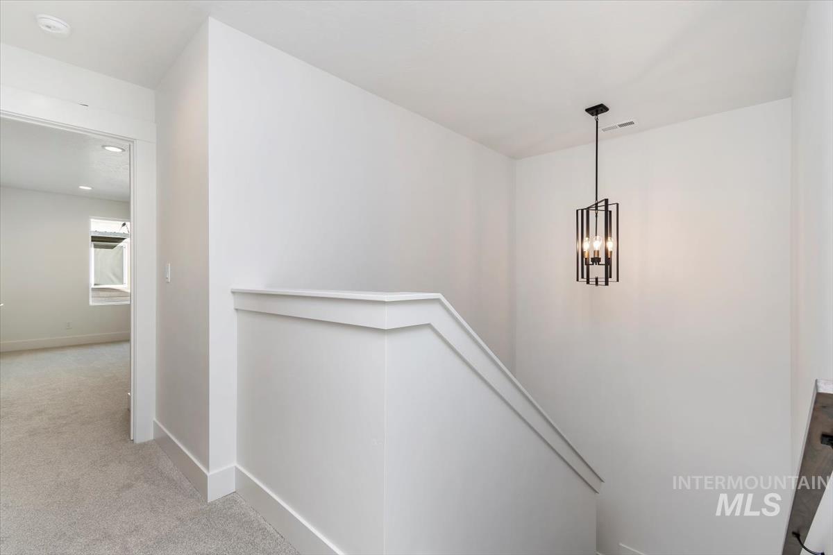 752 South Calhoun Place Star, ID 83669 - Photo 15 of 40 Staircase with carpet flooring and baseboards