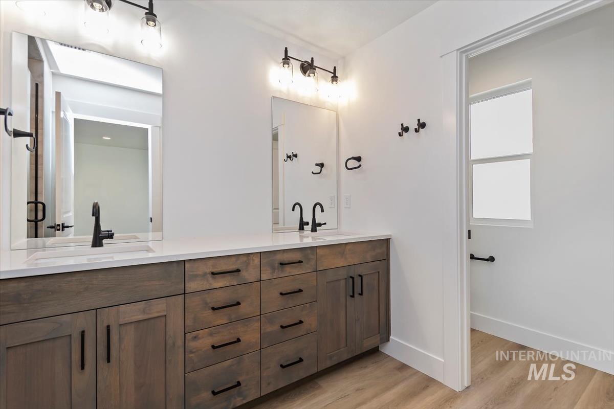 752 South Calhoun Place Star, ID 83669 - Photo 18 of 40 Bathroom with double vanity and light wood-style floors