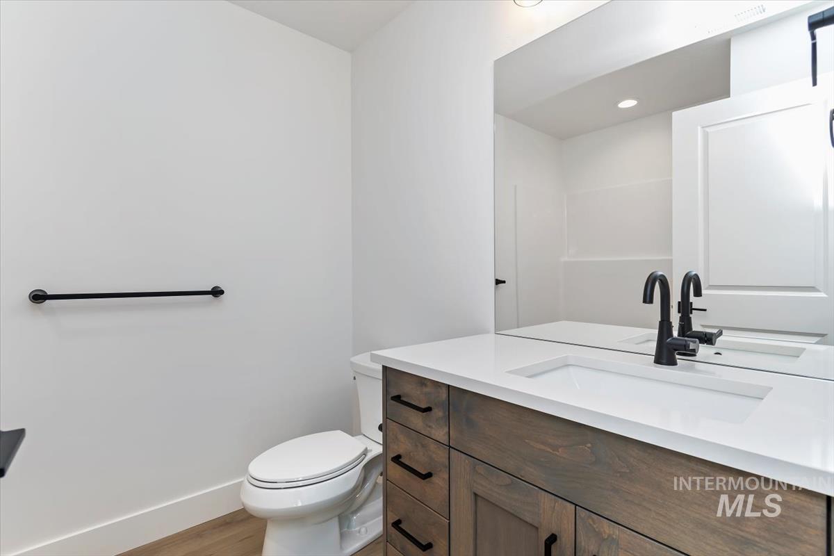 752 South Calhoun Place Star, ID 83669 - Photo 23 of 40 Bathroom with vanity, light wood-style flooring, and recessed lighting