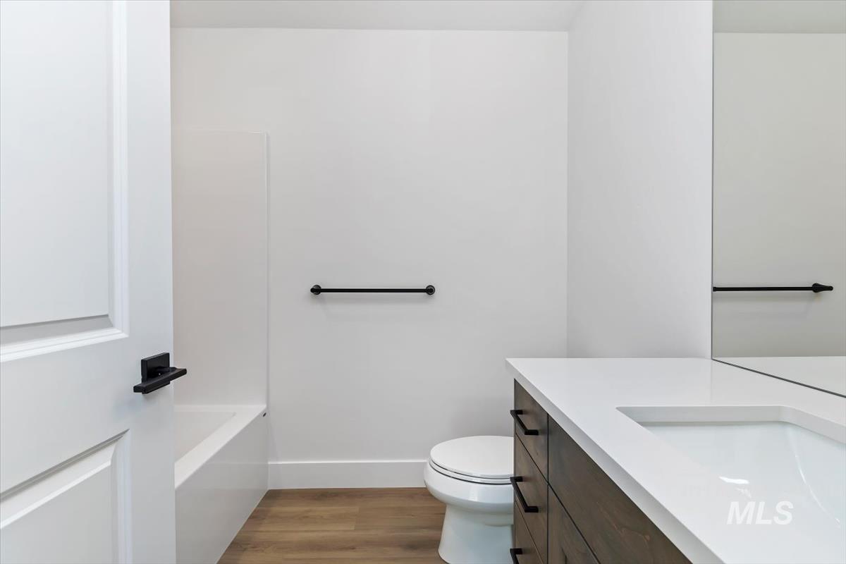 752 South Calhoun Place Star, ID 83669 - Photo 24 of 40 Bathroom featuring vanity, light wood-style floors, and a bath