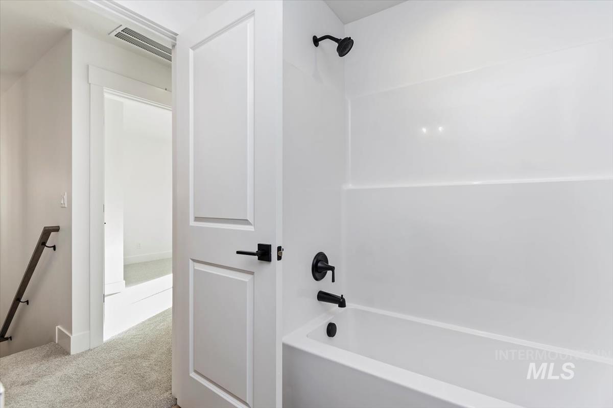752 South Calhoun Place Star, ID 83669 - Photo 25 of 40 Bathroom featuring washtub / shower combination and light colored carpet