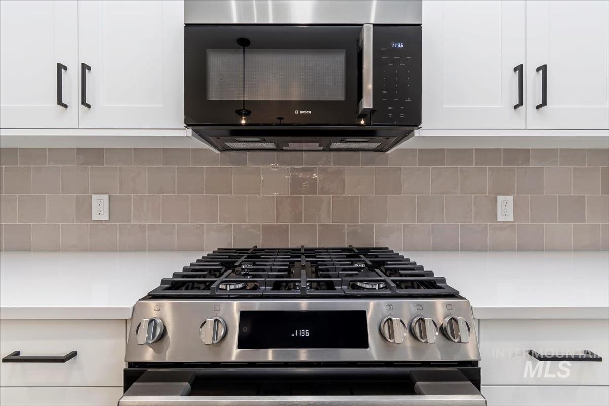 752 South Calhoun Place Star, ID 83669 - Photo 7 of 40 Kitchen view of stainless steel appliances and white cabinets