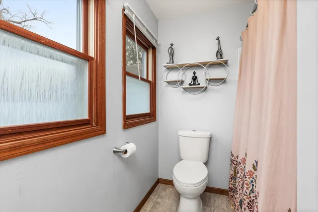 a bathroom with a toilet and a sink