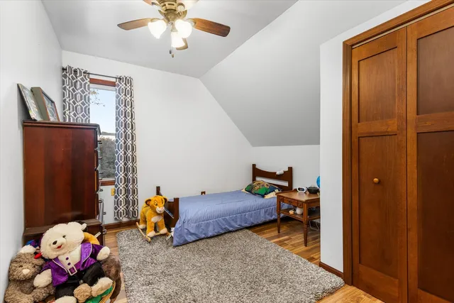 a bedroom with furniture and a window