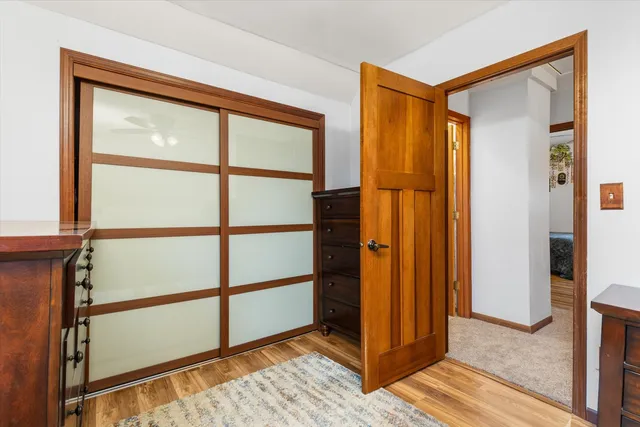 a view of front door with wooden floor