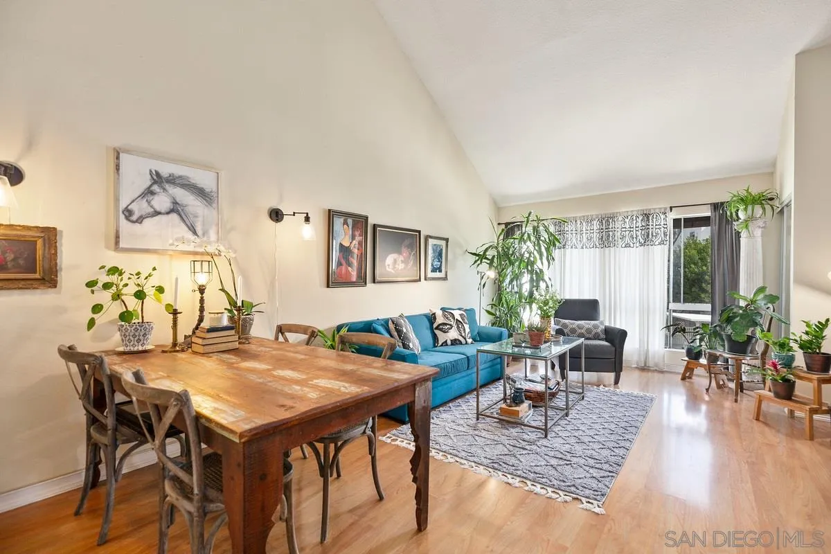 6191 Rancho Mission Road, Unit 304 San Diego, CA 92108 - Photo 1 of 31 a living room with furniture and wooden floor