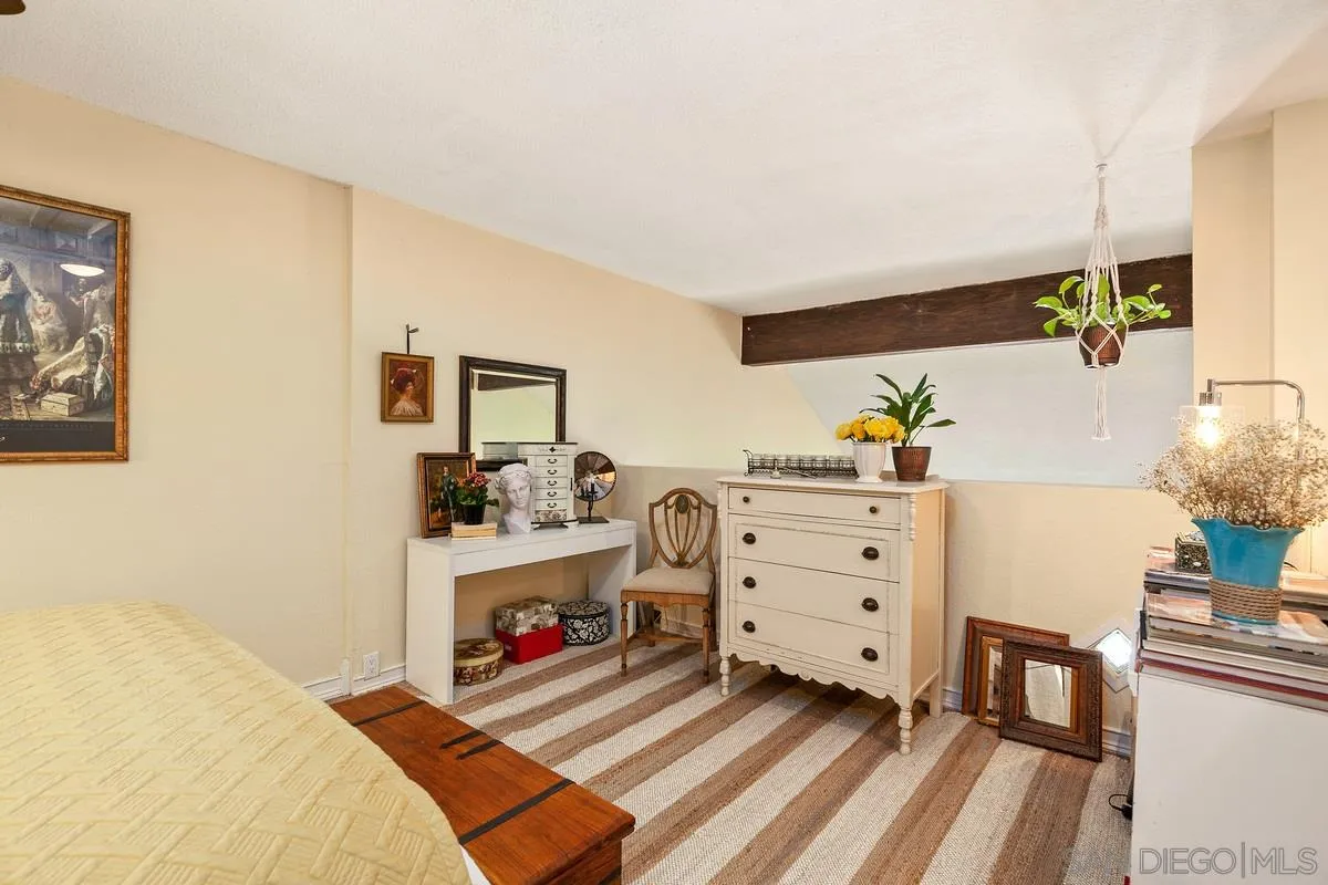 6191 Rancho Mission Road, Unit 304 San Diego, CA 92108 - Photo 20 of 31 a bed room with a bed and a window