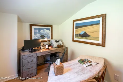 a view of a workspace with furniture