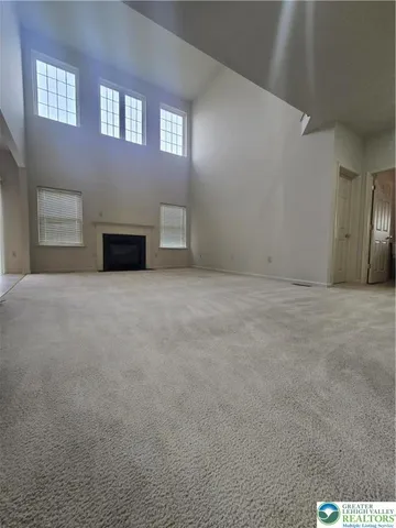 a view of an empty room with windows