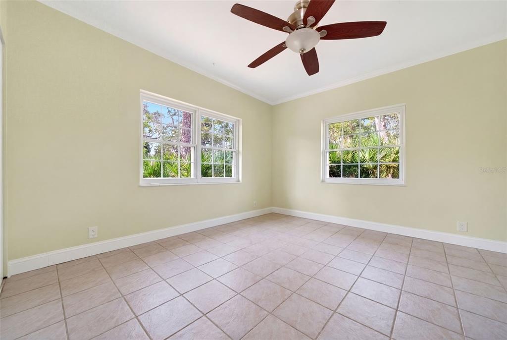 7108 Midnight Pass Road Sarasota, FL 34242 - Photo 53 of 83 an empty room with windows and fan