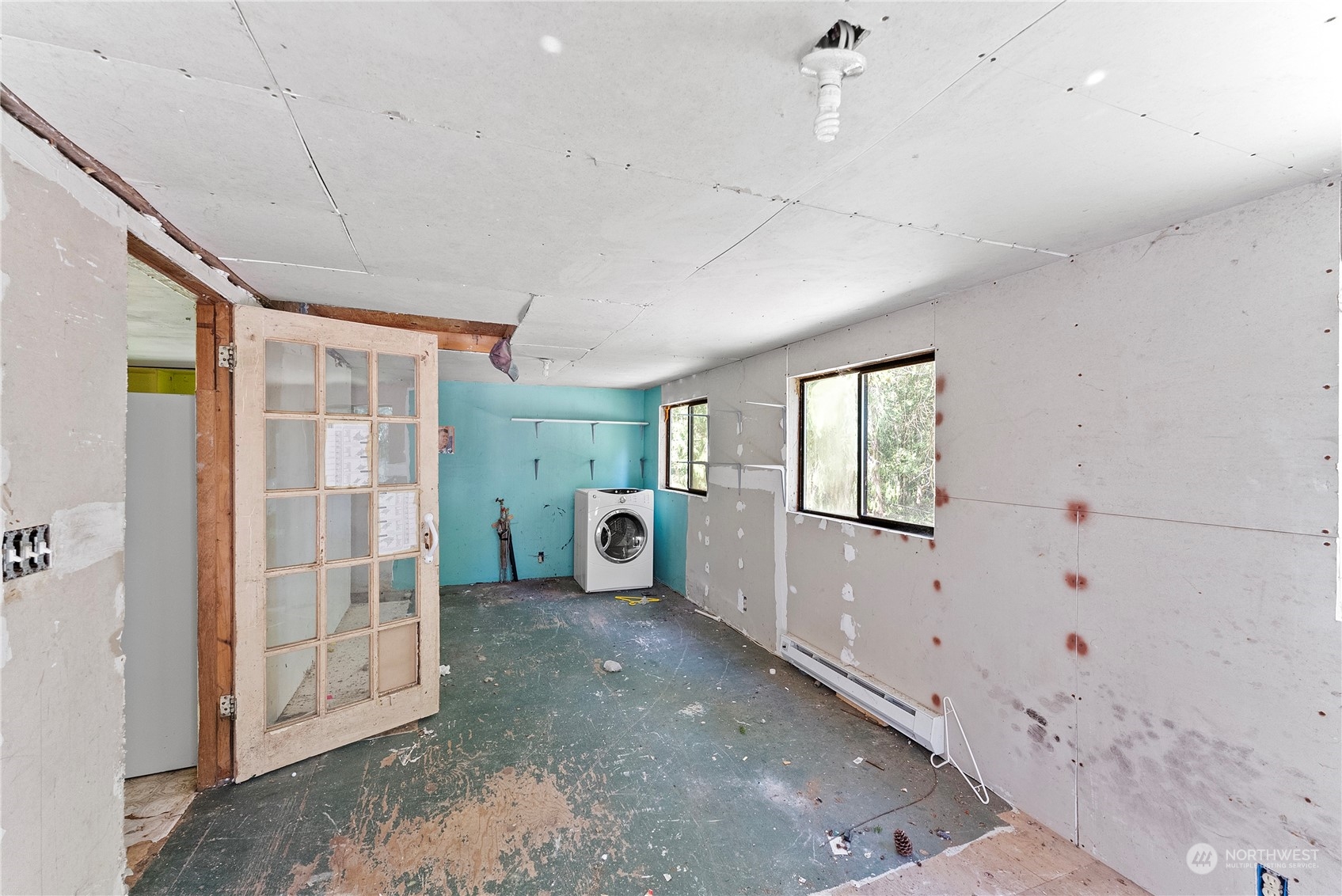 66 Peter Hagen Road Northwest Seabeck, WA 98380 - Photo 11 of 26 a view of livingroom with hardwood floor and window