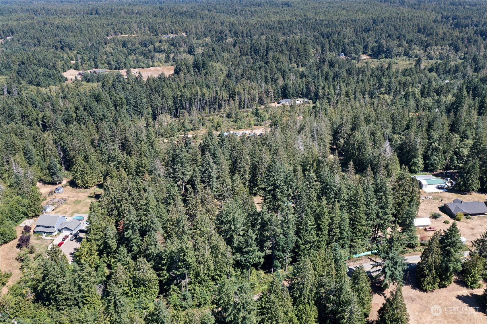 66 Peter Hagen Road Northwest Seabeck, WA 98380 - Photo 24 of 26 an aerial view of multiple house