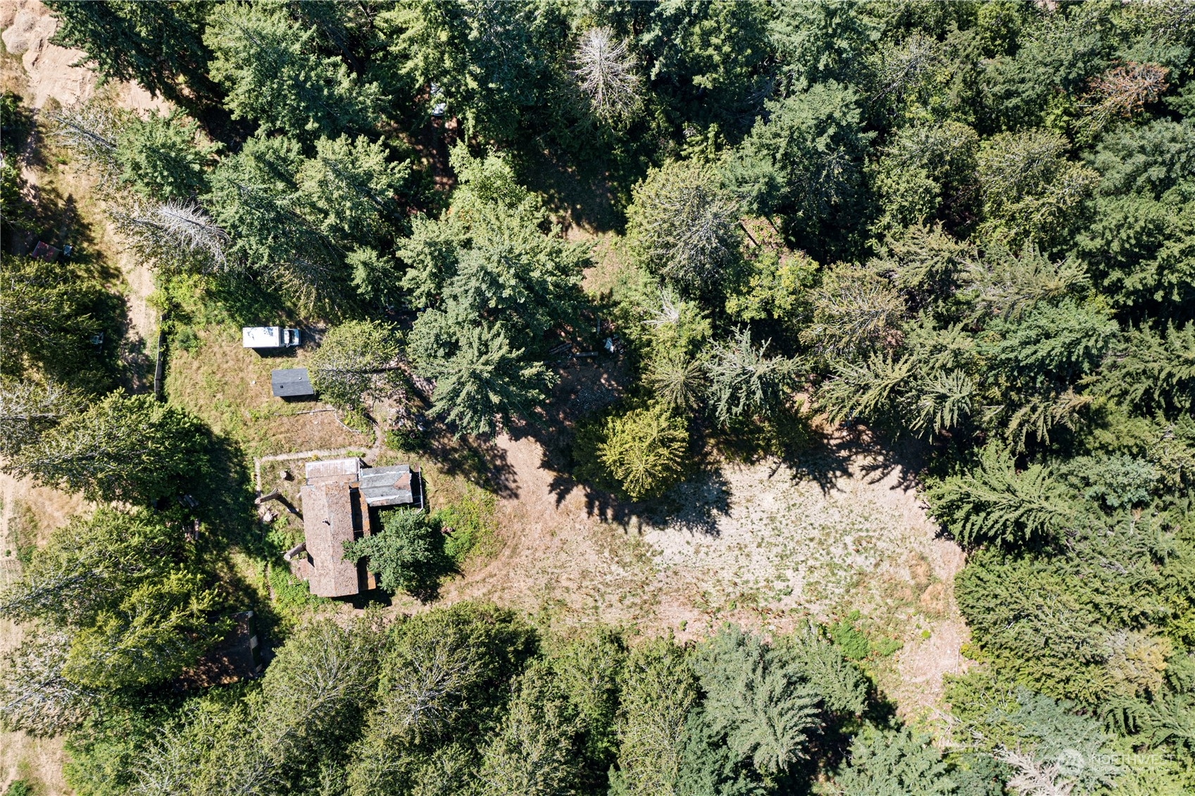 66 Peter Hagen Road Northwest Seabeck, WA 98380 - Photo 3 of 26 an aerial view of residential house with green space