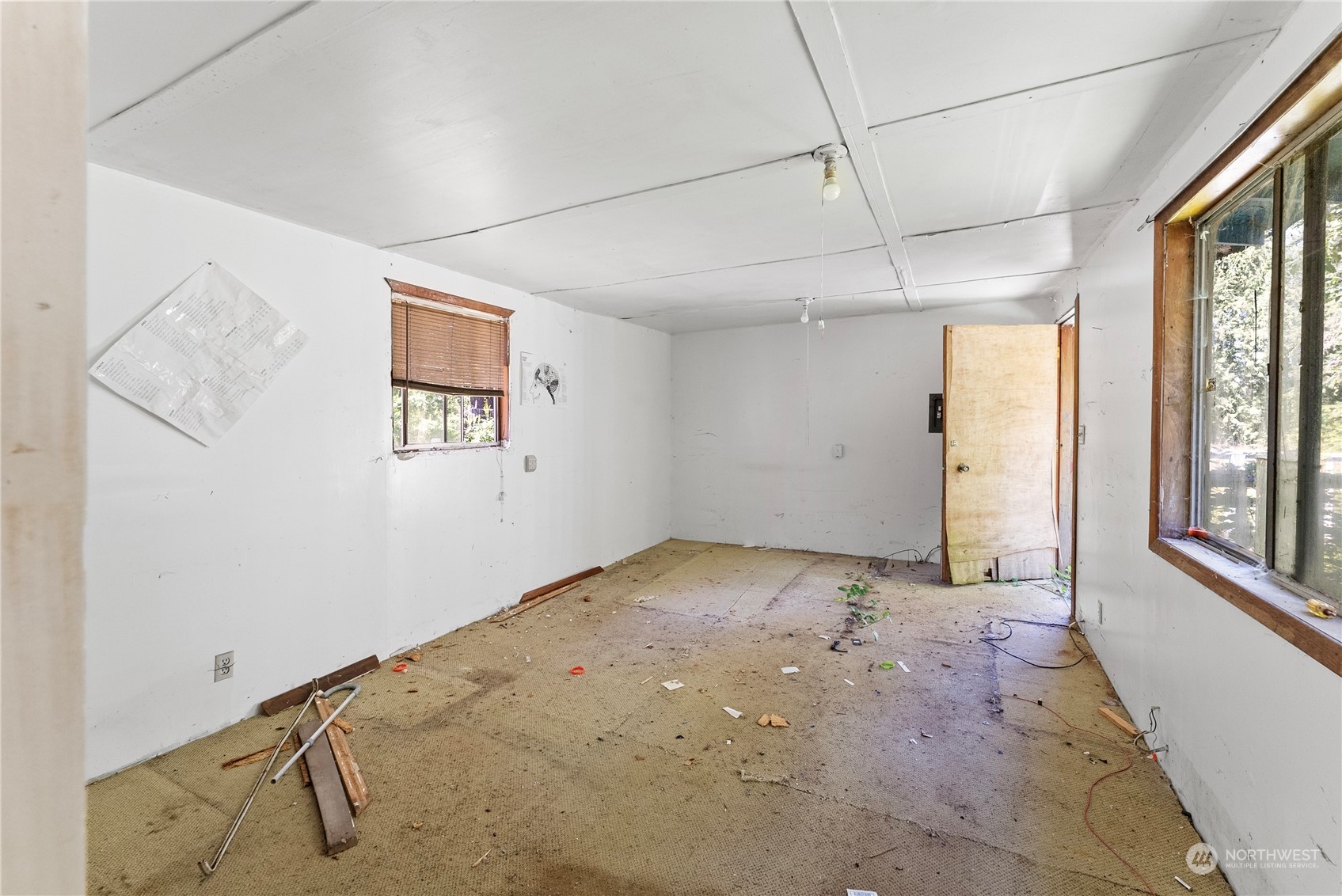 66 Peter Hagen Road Northwest Seabeck, WA 98380 - Photo 10 of 26 a view of an empty room with a window