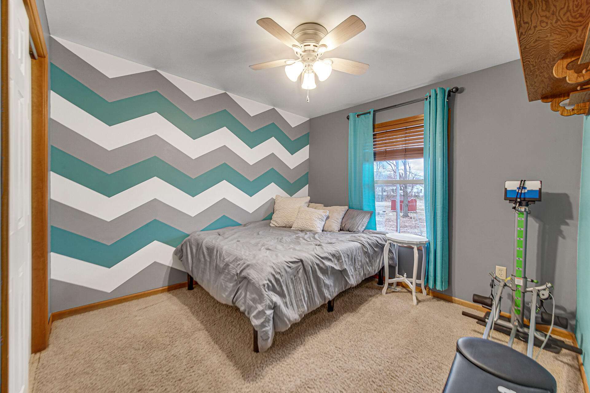 505 North Washington Street Hebron, IN 46341 - Photo 13 of 27 a bedroom with a bed and a chandelier